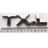 Emblema TXL para Toyota Prado Cromado - vista 2 - Importoyota Colombia